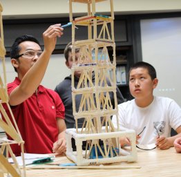 students building with teacher