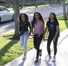 smiling students walking